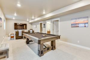 a living room with a pool table in it at Park City Home with Game Room Ski, Mtn Bike and More! in Park City