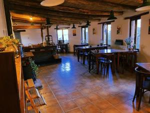 a restaurant with tables and chairs in a room at Cabañas Malka in Tilcara