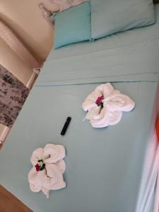 Giường trong phòng chung tại Rose Hideaway