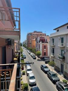 a city street with cars parked on the street at Il Canto del Gallo in Crotone