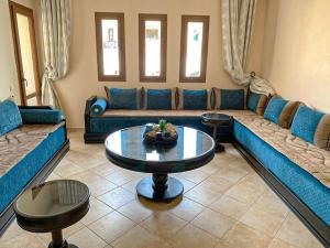 Posezení v ubytování Appartement climatisé vue piscine - Lilacs garden CaboNegro