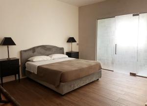 Voodi või voodid majutusasutuse Alèa Rooms toas