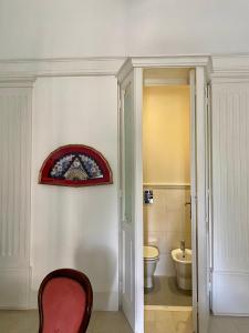 a bathroom with a toilet and a window on the wall at Monfort Club B&B in Campobasso +60 photos