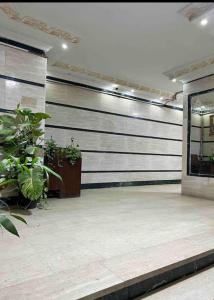 a room with black and white stripes on the wall at Pyramids Suite in Cairo