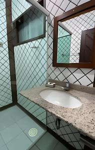 a bathroom with a sink and a mirror at Pousada Ventos do Mar in Natal +35 photos