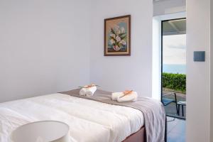 Postel nebo postele na pokoji v ubytování GuestReady - Delight Getaway in Madeira