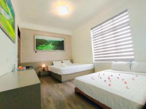 Postel nebo postele na pokoji v ubytování THUY DUNG TAM COC HOMESTAY