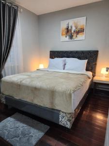 Porlak Hebron Family Homestay Silangit客房内的一张或多张床位