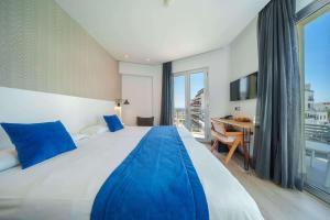 Postel nebo postele na pokoji v ubytování Mar Calma Hotel