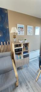 a living room with a couch and a table at Le 246 - Duplex face à la mer pour 4 personnes, Wifi, TV full Sat, Parking in Wimereux