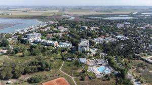 an aerial view of the resort and the river at Laguna Park Hotel 4Superior in Bibione