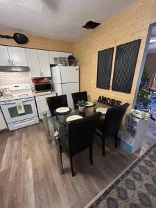 a kitchen with a table and chairs in a kitchen at Spa Retreat - Hot Tub & Massage Chair in Middle Grove +20 photos