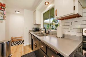 a kitchen with a sink and a counter top at Lanka Rose House by WanderLodges in Phoenix +12 photos