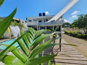 a house with a pool in front of it at Sandy Bay Paradise Retreat - 7 Bedrooms in Sandy Bay