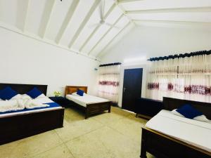 Voodi või voodid majutusasutuse Surfing Beach Nilaveli toas