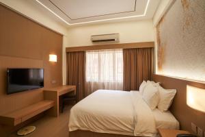 TV a/nebo společenská místnost v ubytování BTC Hotel 比特币酒店