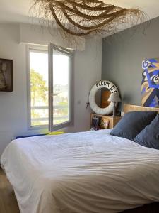 En eller flere senge i et værelse på Appartement Moderne Hyper Centre, Marché Plein Sud