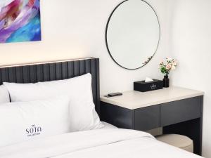 A bed or beds in a room at SOTA SUITE Yangyang Granbay