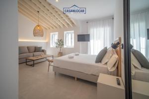 Ένα ή περισσότερα κρεβάτια σε δωμάτιο στο Sanlucar Centro - Apartamento 4