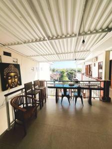 a dining room with a table and some chairs at Kailash Villa Balangan in Jimbaran