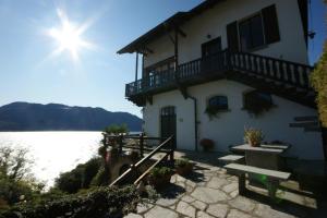 a house on the shore of a body of water at Miralba in Ghiffa