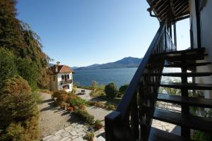 a balcony of a house with a view of the water at Miralba in Ghiffa