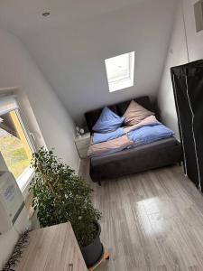 Postel nebo postele na pokoji v ubytování Panoramablick in Litzendorf + 14 fotografií