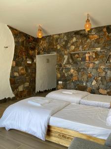 Postel nebo postele na pokoji v ubytování Panorama Guest House Jabal Shams