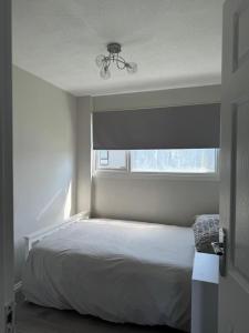 En eller flere senge i et værelse på Costal retreat - chalet 275