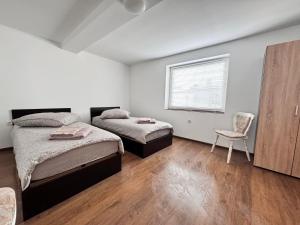Postel nebo postele na pokoji v ubytování Gästehaus EMELI