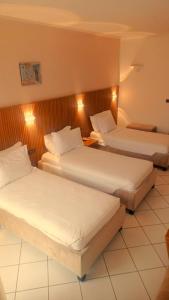 Postel nebo postele na pokoji v ubytování Appart-Hotel EZZAHIA by HMS