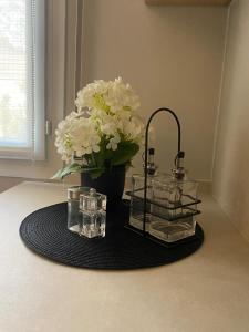 a table with a vase of white flowers and candles at ALMA de Bardenas in Arguedas +20 photos