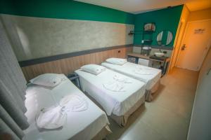 Postel nebo postele na pokoji v ubytování Hotel Coroados Foz Express