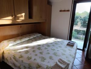 Postel nebo postele na pokoji v ubytování Villa Mori + 18 fotografií