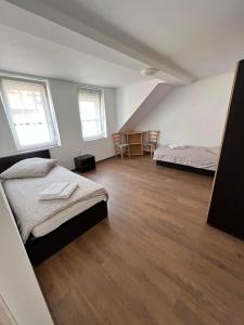 Postel nebo postele na pokoji v ubytování Gästehaus EMELI