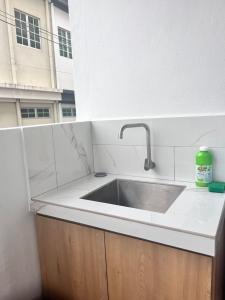 a kitchen counter with a sink and a window at Jambul Villa 3-storey corner House 6Bed5Bathroom in Bayan Lepas +31 photos