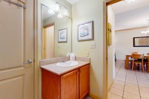 a bathroom with a sink and a mirror at Mountain View Condo 5404 in Pigeon Forge +12 photos