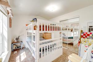 a white room with two bunk beds in it at Peaceful Entiat Home Pets Welcome! in Entiat