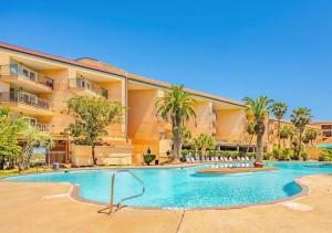Bazén v ubytování Poolside Paradise nebo v jeho okolí