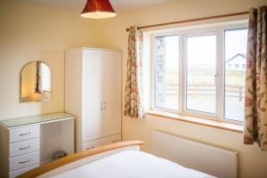 Ένα ή περισσότερα κρεβάτια σε δωμάτιο στο Atlantic Sunset +39 φωτογραφίες