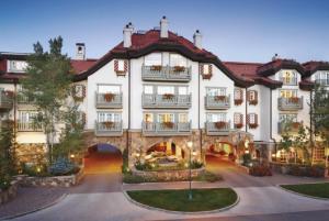 a large white building with balconies on it at Vail Sonnenalp King Hotel Room in Vail