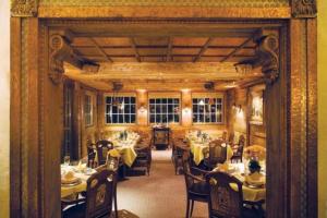 a dining room with tables and chairs in a room at Vail Sonnenalp King Hotel Room in Vail +13 photos