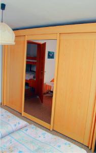 a room with a sliding door with a mirror at Haus Rita in Thurmansbang
