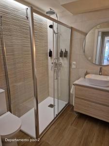 a bathroom with a shower and a sink at Oliva Apartments Gracia in Málaga +26 photos