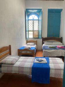 Postel nebo postele na pokoji v ubytování Pousada e Camping Lumiar