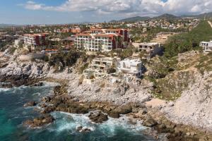 an aerial view of a resort on a rocky coast at Villa Alegria in El Pueblito