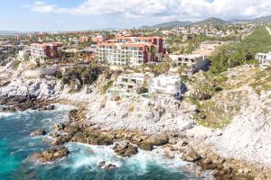 an aerial view of a resort on a rocky coast at Villa Alegria in El Pueblito