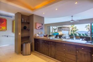 a kitchen with a large sink and a large window at Villa Alegria in El Pueblito