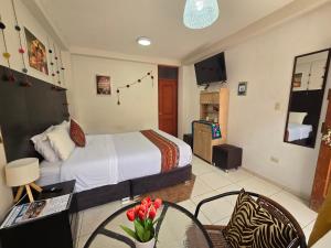Uma cama ou camas num quarto em Cusco Rooms