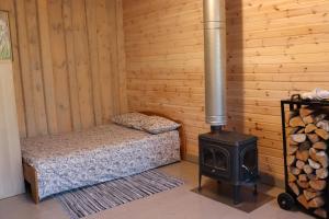 Postel nebo postele na pokoji v ubytování Kundziņi